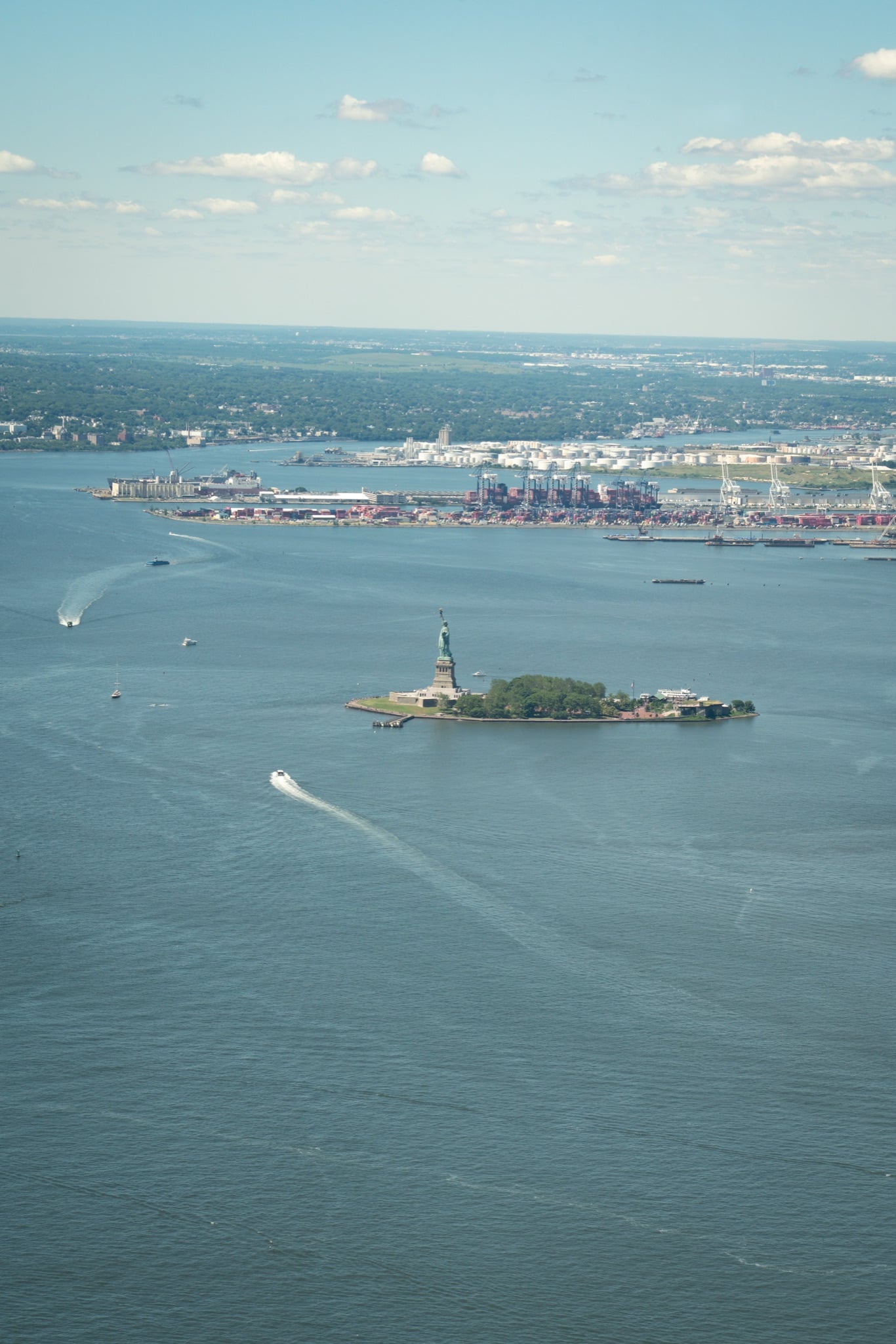 The Statue of Liberty standing over the harbor