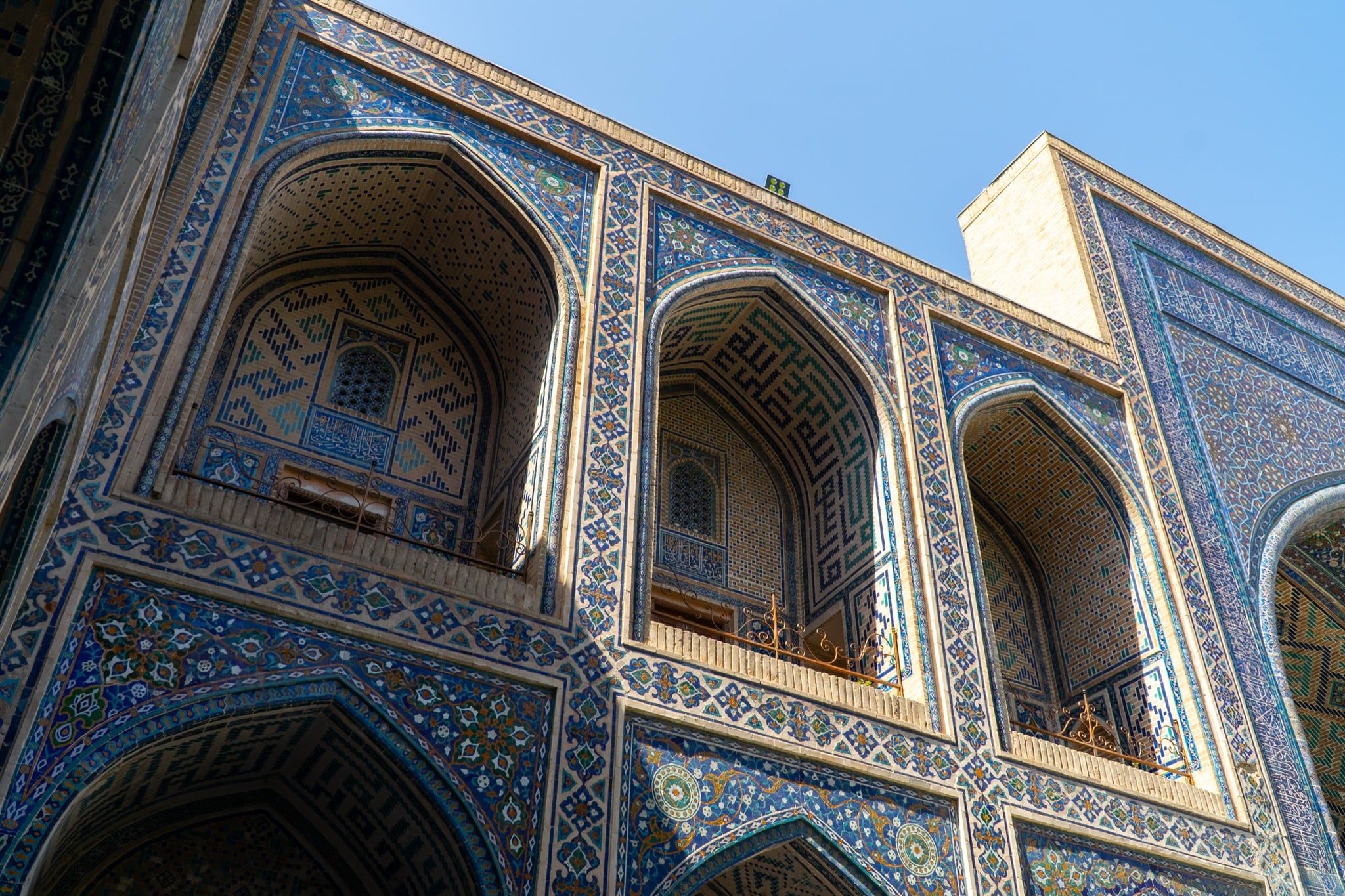 Registan Square lit under an open sky, Samarkand