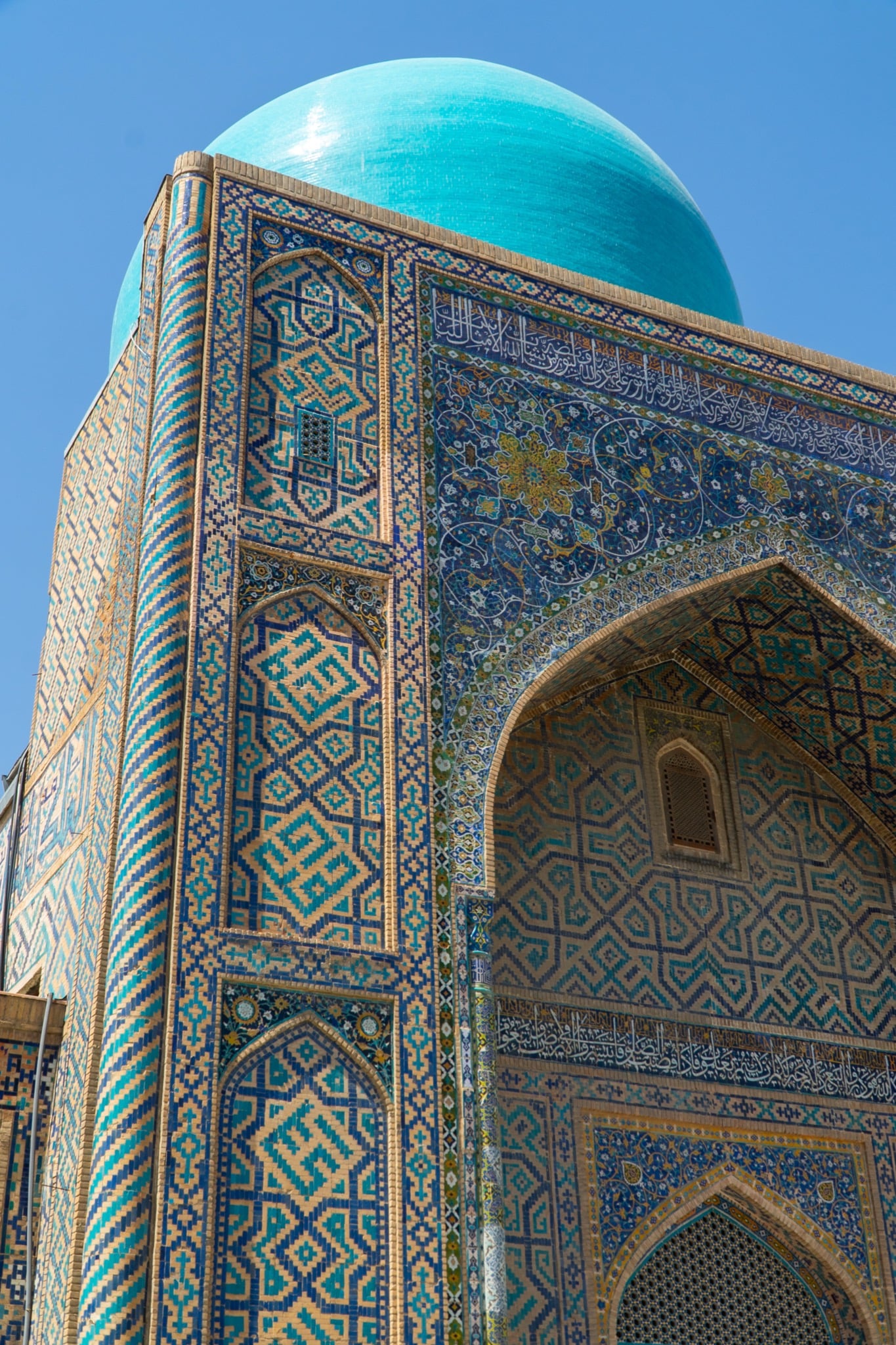 A minaret rising above the Registan Square courtyard, Samarkand