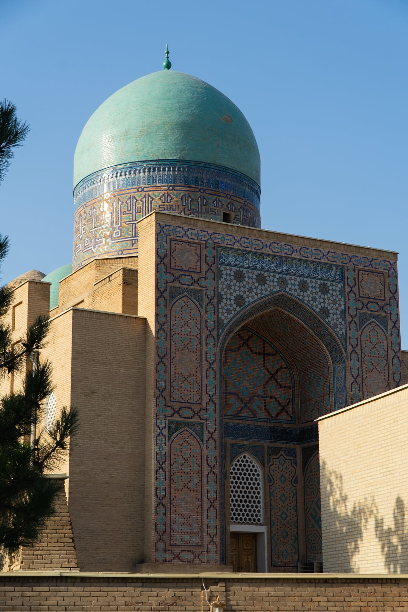 A blue-tiled mosque dome above Samarkand